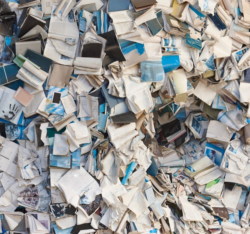 Paper waste, recyclable materials. Sustainable environment. Garbage container